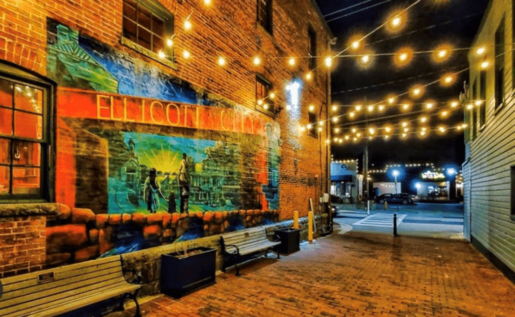 Ellicott city mural lit by string lighting 